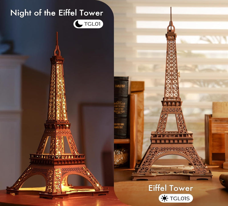 Two Eiffel Tower models, one illuminated and the other on a table.