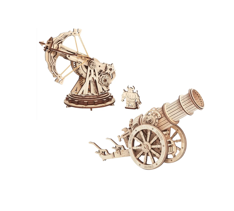 Wooden model kits of a crossbow and cannon on a white background