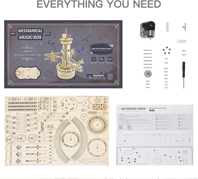 Mechanical music box kit with packaging, parts, and instructions on a white background.