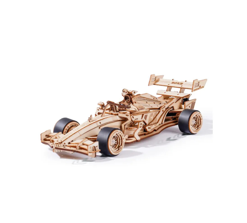 Wooden model of a Formula 1 car on a white background