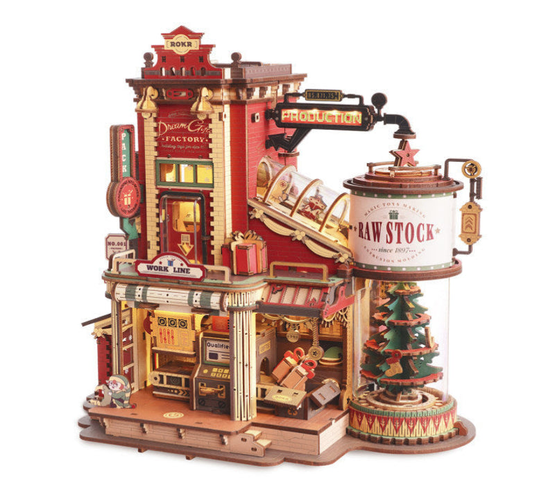 Detailed model of a factory with various sections and a Christmas tree display.