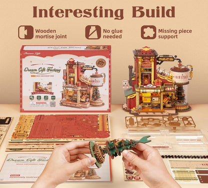 Wooden model building set with instructions and a completed model on a beige background